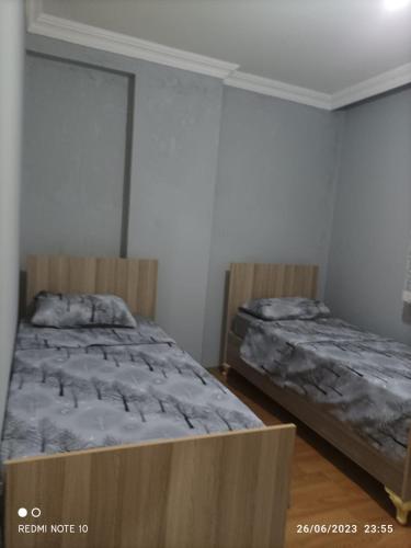 a bedroom with two beds in a room at Goldwinn turizm in Trabzon