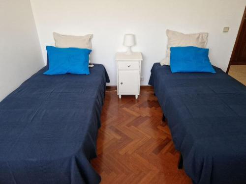 Postel nebo postele na pokoji v ubytování Spacious T2 Charneca Caparica