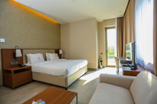 Citymax Hotel Baku tesisinde bir odada yatak veya yataklar
