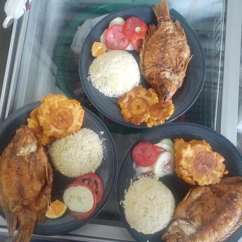 a group of plates of food in a refrigerator at Glamping eco descanso la vega Nocaima in Nocaima