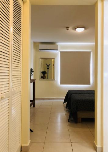 Cama o camas de una habitación en # Blue Bay Beach - Ocean View Apartments - FULLY AIR CONDITIONED #