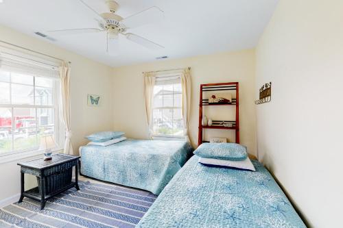 a bedroom with two beds and a window at Town of South Bethany --- 142 Henlopen Drive in Bethany Beach