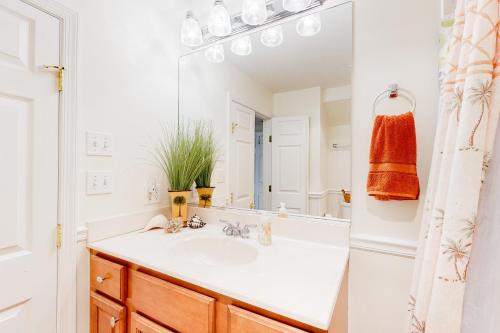 a bathroom with a sink and a mirror at Town of South Bethany --- 142 Henlopen Drive in Bethany Beach