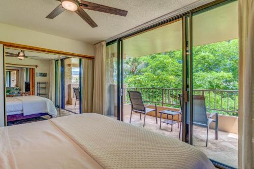 a bedroom with a bed and a balcony at Paki Maui 327 in Kahana