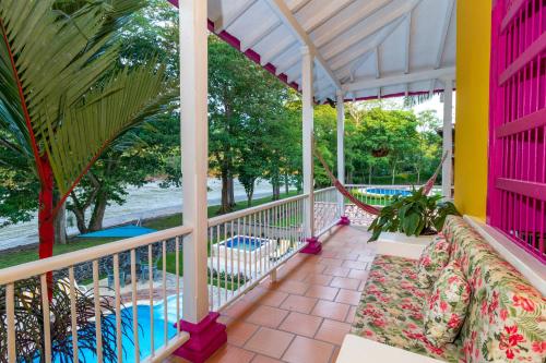 a balcony with a hammock and a pool at Casa Etnika in Jericó