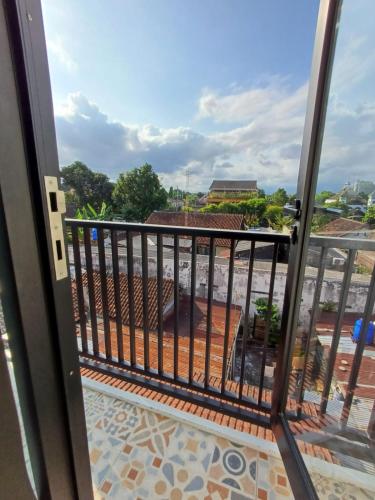 a view from the balcony of a building at Grownicle Living Syariah in Timuran