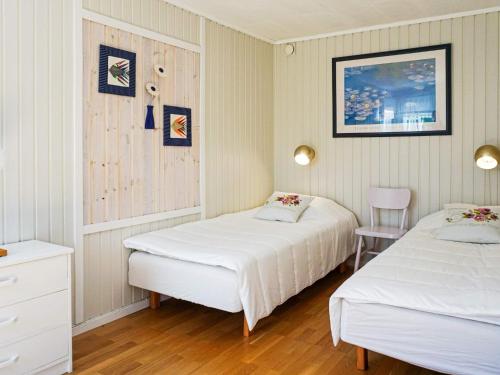 Ένα ή περισσότερα κρεβάτια σε δωμάτιο στο 10 person holiday home in Brastad-By Traum