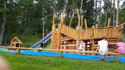 a group of people walking around a playground at luxurious 2-room apartment in central Borås in Borås