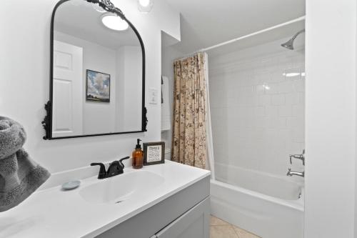 a white bathroom with a sink and a shower at New! Sapphire Ridge Escape to Shenandoah River in Front Royal