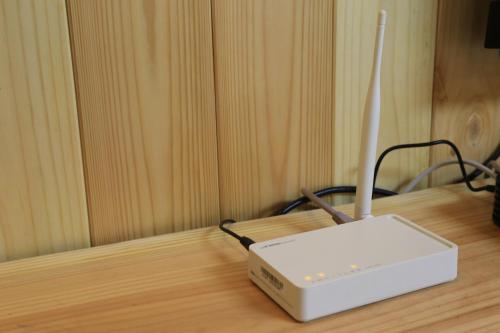 a router sitting on top of a wooden table at Jeju Best Hill in Jeju