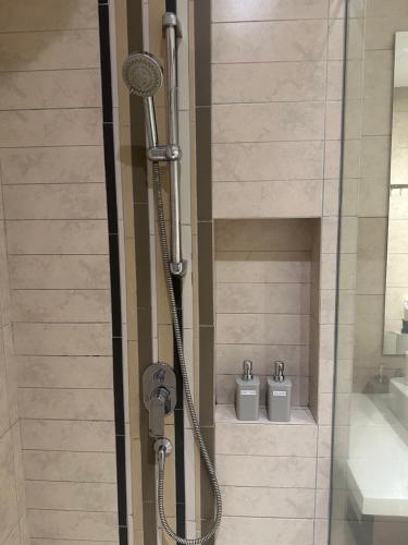 a shower in a bathroom with two toilets at The Robertson 1R1B/High flr-cosy room/ Bukit-bint in Kuala Lumpur