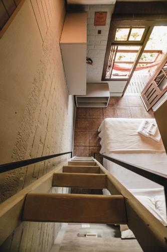 a group of stairs in a room with a ceiling at Pousada Colina Verde in Garopaba