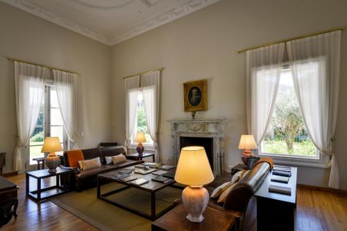 a living room with a couch and a fireplace at Estancia La Paz Hotel in Ascochinga