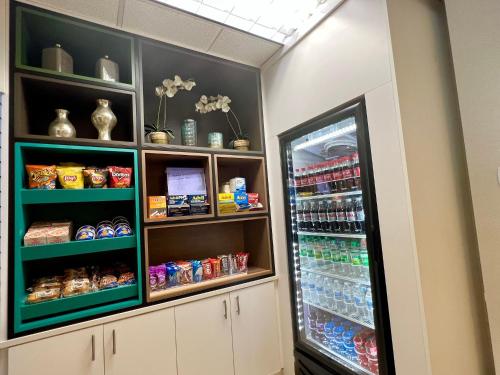 a refrigerator filled with lots of food and drinks at Holiday Inn Toledo - Maumee I-80/90 by IHG in Maumee