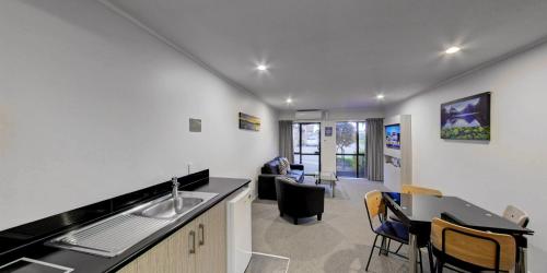 a kitchen with a sink and a counter top at Arista of Rotorua in Rotorua