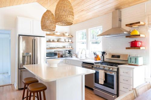a kitchen with white cabinets and a counter top at 106 the Church St Collection with pool in Fairhope