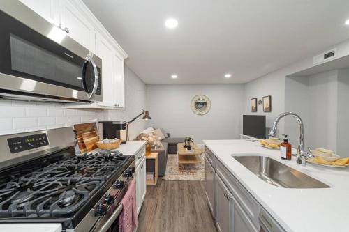 a kitchen with a stove and a sink at Suite Dreams 2BR Parking Yale New Haven Lawn Club in New Haven