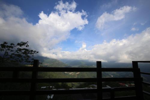 a view of the mountains from a fence at Villa Relax in Renai