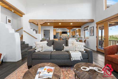 a living room with a couch and a table at Hillside Haven Retreat - A Placitas Irvie Home in Santa Ana Pueblo