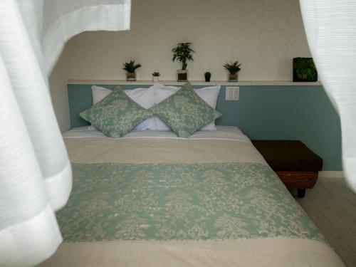 Ένα ή περισσότερα κρεβάτια σε δωμάτιο στο Cozy Stay in Naha