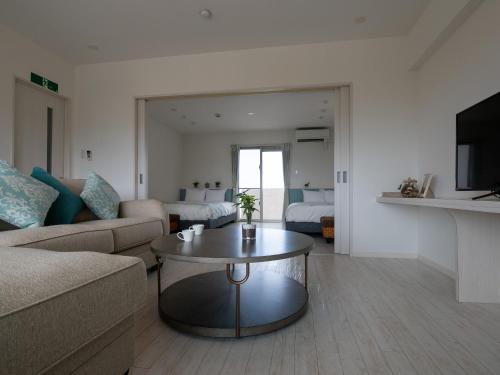 Χώρος καθιστικού στο Cozy Stay in Naha