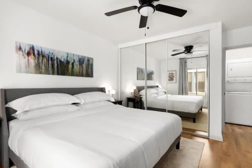 a bedroom with two beds and a ceiling fan at Double King Suite with Patio Dining and Parking NRP21-00386 in Long Beach