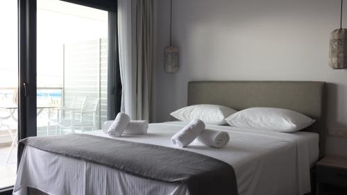 Ένα ή περισσότερα κρεβάτια σε δωμάτιο στο Nautico Rooms