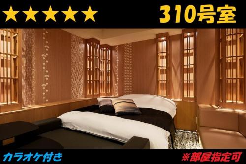 Ένα ή περισσότερα κρεβάτια σε δωμάτιο στο HOTEL Us Racecourse Adult only