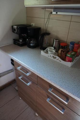 a kitchen with a counter top with a coffee maker at Chata Žár in Žár