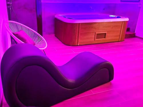 a purple room with a chair and a table at Residence Del Tellaro in Noto Marina