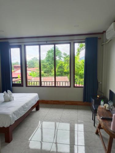 Katil atau katil-katil dalam bilik di Vang Vieng Champa Resort
