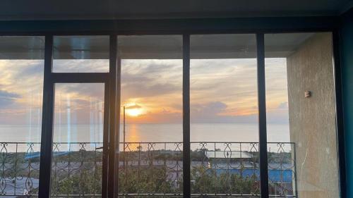 a view of the ocean from the window of a house at Royal Ak-Terek Issyk-kul in Ak-Terek