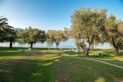 a park with trees and a body of water at Govino Bay bliss - shared pool in Danilia