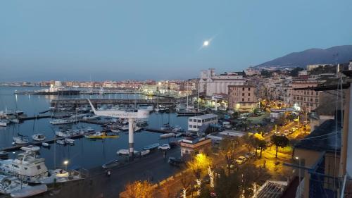 a cityscape of a harbor at night at Coralinetiny in Castellammare di Stabia