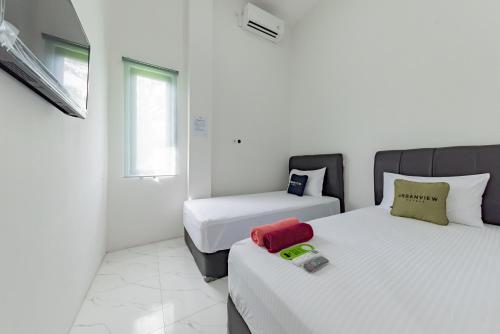 Легло или легла в стая в Urbanview Hotel La De Grizz Syariah Sampit by RedDoorz