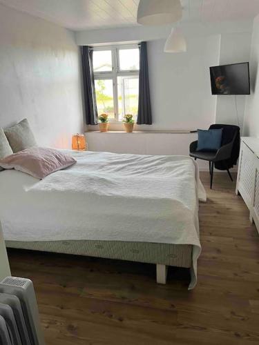 Voodi või voodid majutusasutuse Marielyst, idyllisk feriehus 800m fra torvet toas