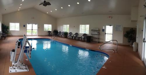 a large swimming pool in a large room at Microtel Inn & Suites Beckley East in Beckley