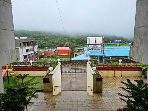 a view of a city from a building at Suman Cottage & Bungalow in Mahabaleshwar