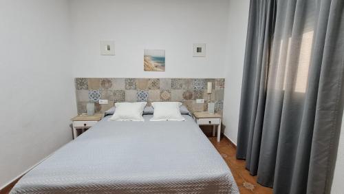 Postel nebo postele na pokoji v ubytování Hostal Canalejas