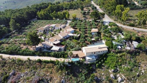 an aerial view of a house on a hill at Baglio Cracchiolo da Tuzzo - Casa Bouganville in San Vito lo Capo