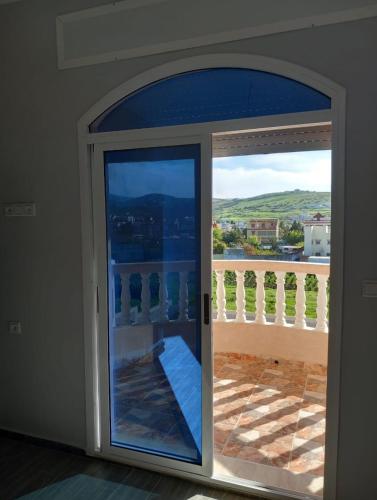 an open door with a view of a balcony at Appartment with terrrasse ANDALUCIA Inn Tanger in Tangier