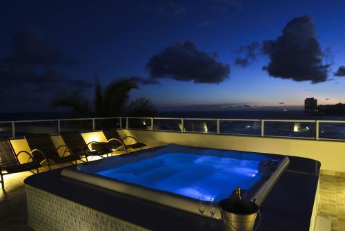a swimming pool on the balcony of a building at Rede Andrade Express in Salvador