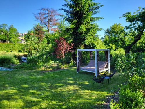 a hammock in the grass in a garden at Apartmán v podzámčí in Rychnov nad Kněžnou