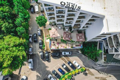 an overhead view of a parking lot with parked cars at Hotel Oasis in Sarandë