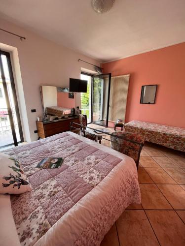 a bedroom with a large bed and a mirror at The Tower Of The Old King in Desenzano del Garda