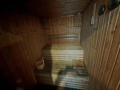 an empty wooden sauna with a bucket in it at 5A-Short-term rental allowed-2BRs Downtown Bangkok in Makkasan
