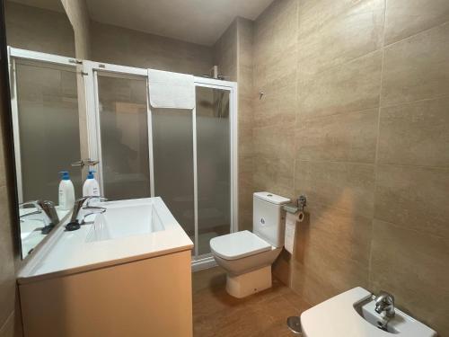 a bathroom with a white sink and a toilet at Rincon de la Victoria - PMay in Rincón de la Victoria