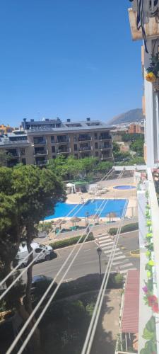 a view of a swimming pool from a building at Acuario shared flat piso compartido est partagé الشقة مشتركة in Benalmádena
