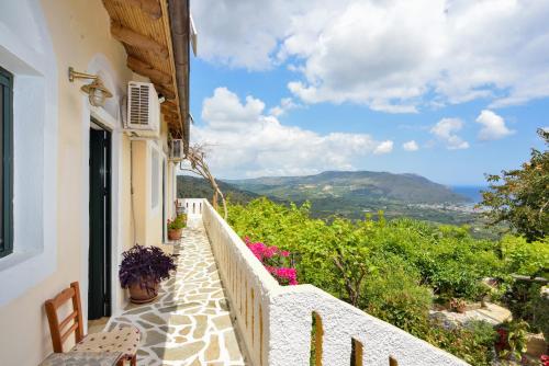 a balcony of a house with a view of the ocean at Villa Kapasa in Mathés