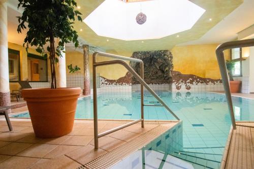 a indoor swimming pool in a hotel at Aktivhotel Waldhof in Oetz